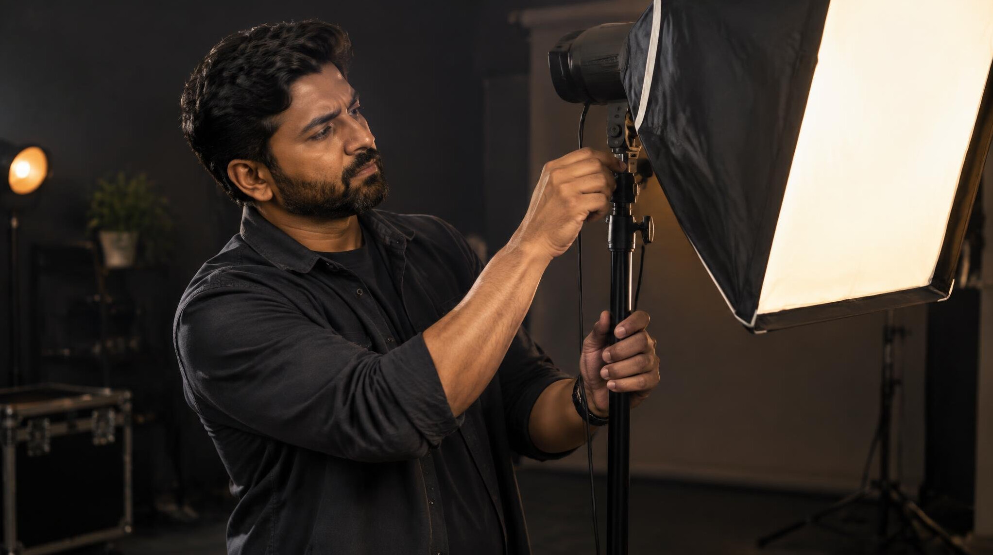 Technician adjusting a studio light